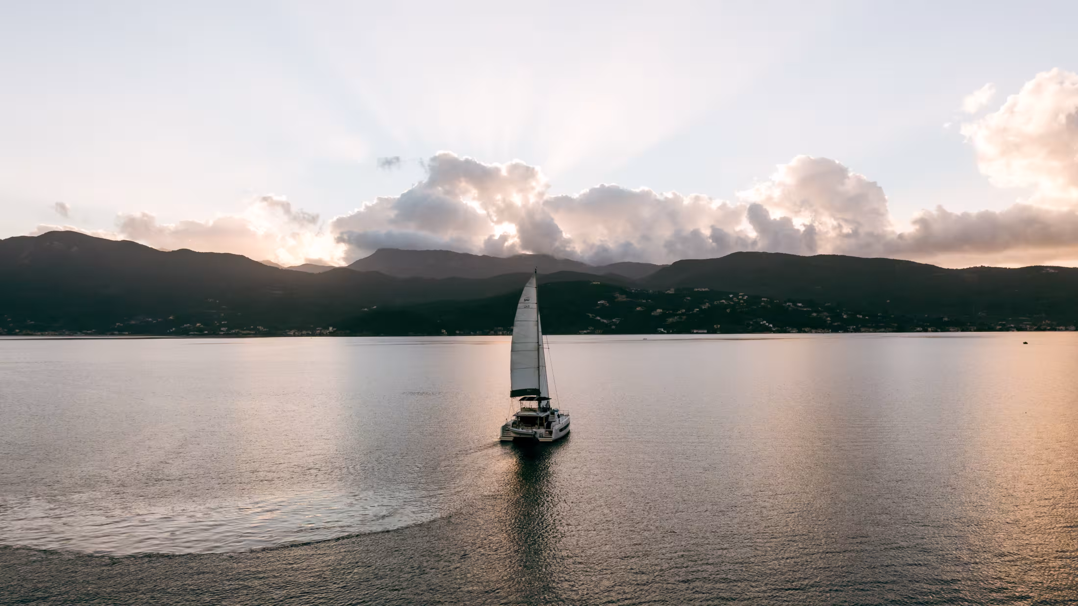 Yacht traveling on green Ionian Sea